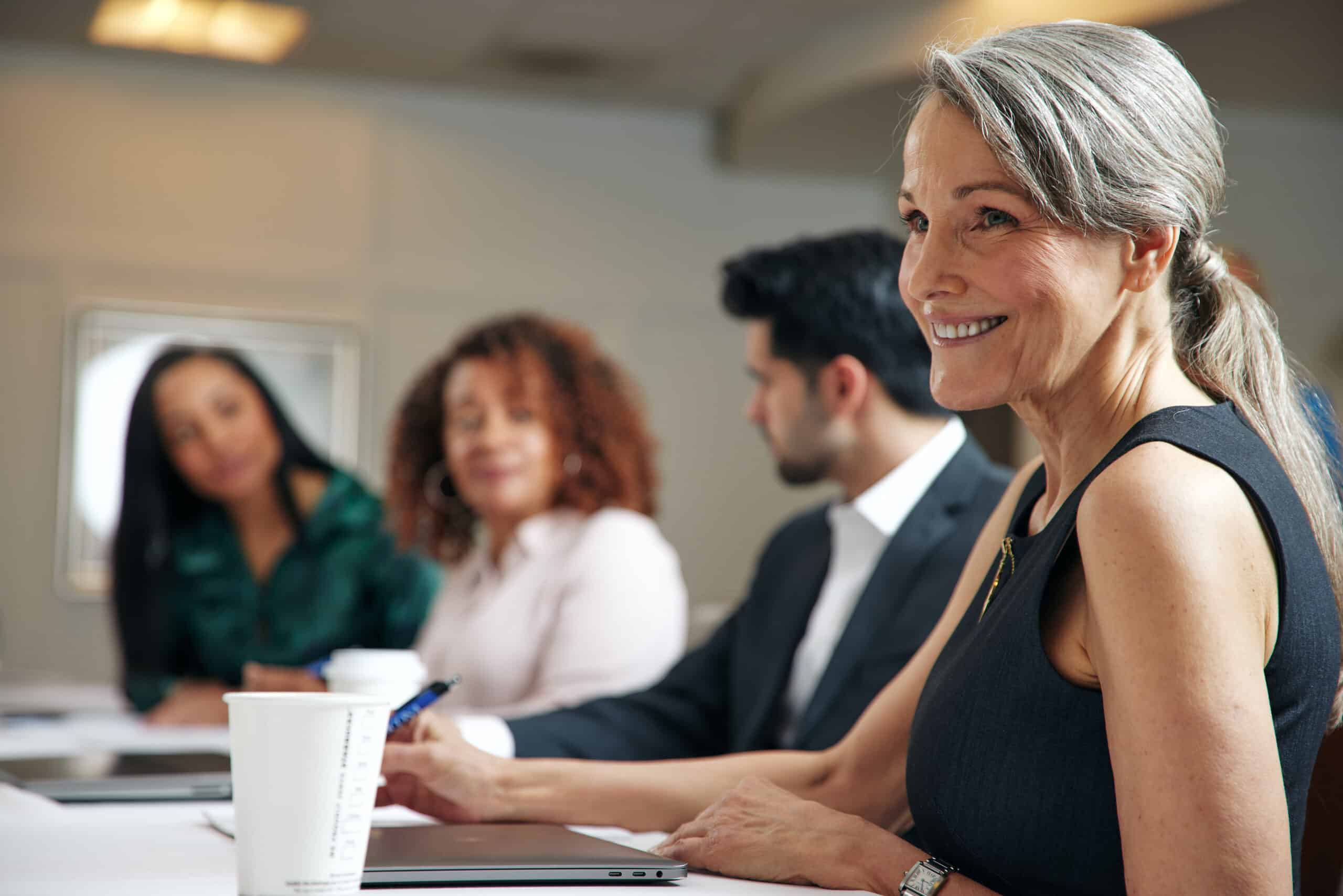 Coworkers sitting at a table at a corporate retreat venue