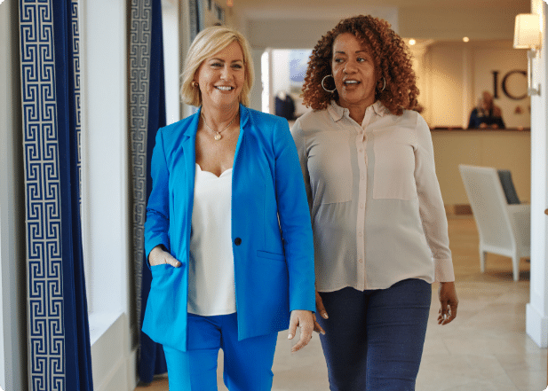 Two women talking at a corporate event hotel